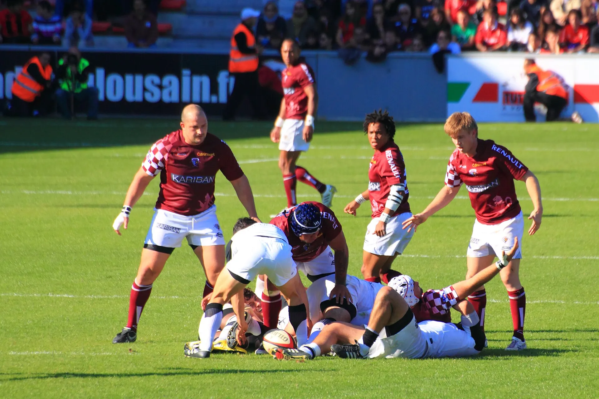 Players compete for the ball at a ruck during phase play