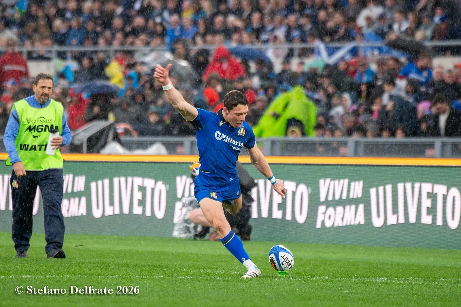A rugby player strikes a kick during a Six Nations match