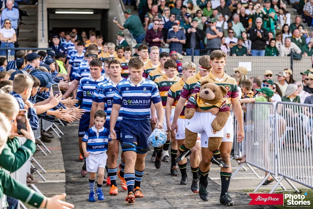 Paarl Boys' High players walking out onto the pitch through a clapping crowd before a match