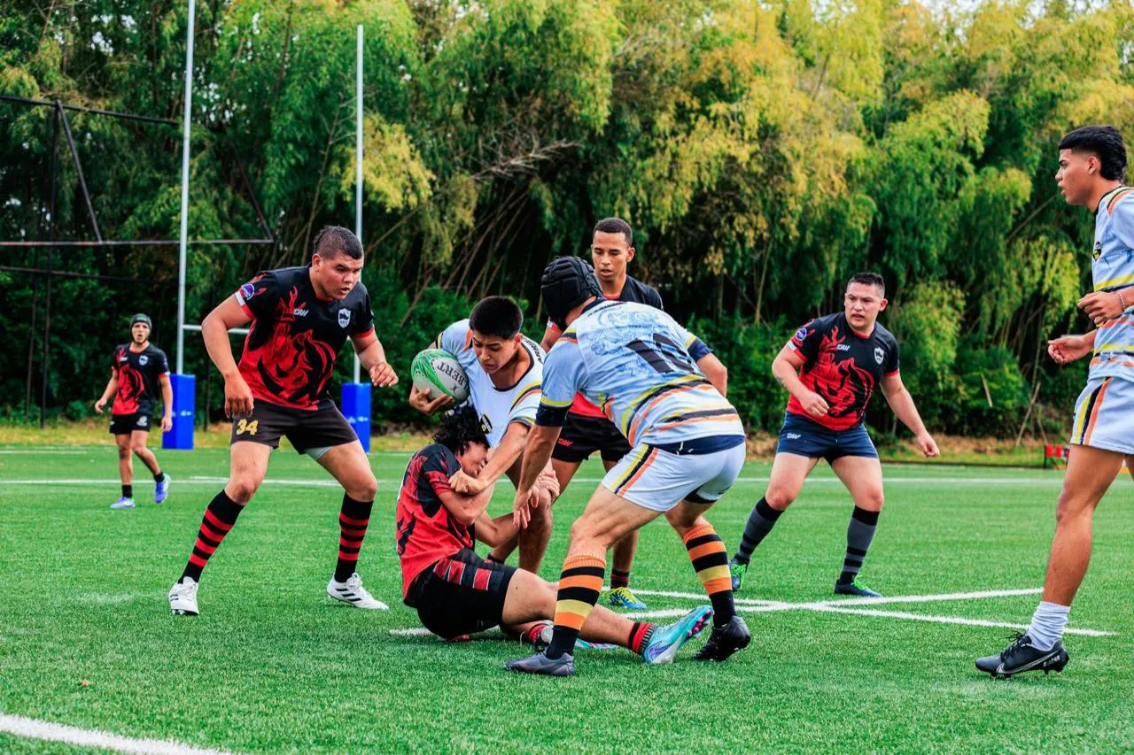 A rugby player making a tackle during a match