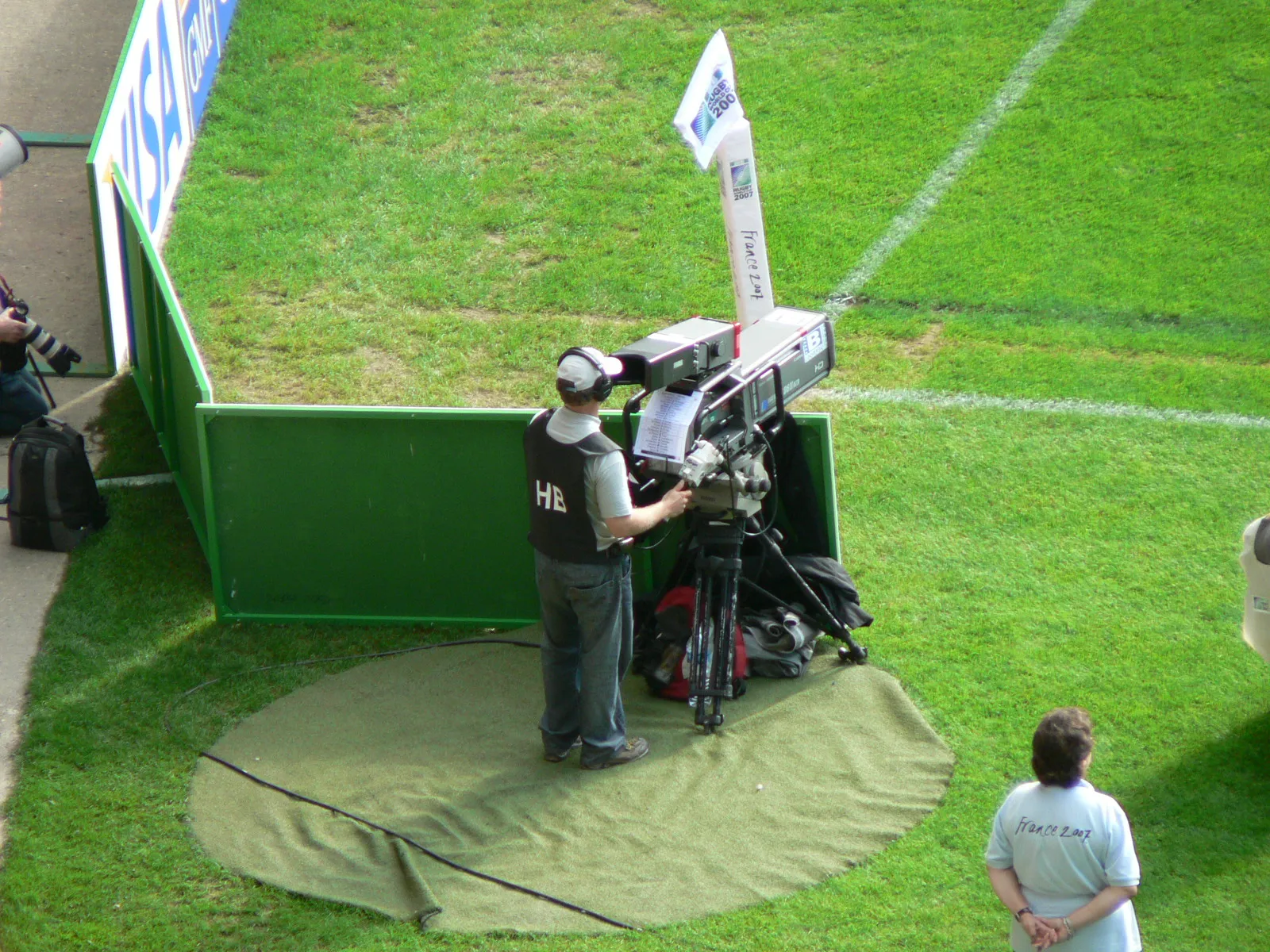 A rugby match in play, seen from beside the pitch