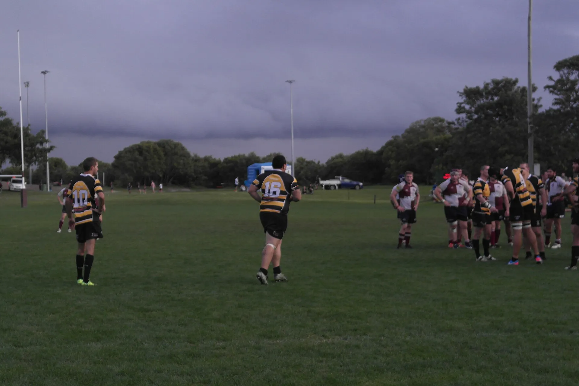 A replacement wearing number sixteen runs onto the pitch during a club match