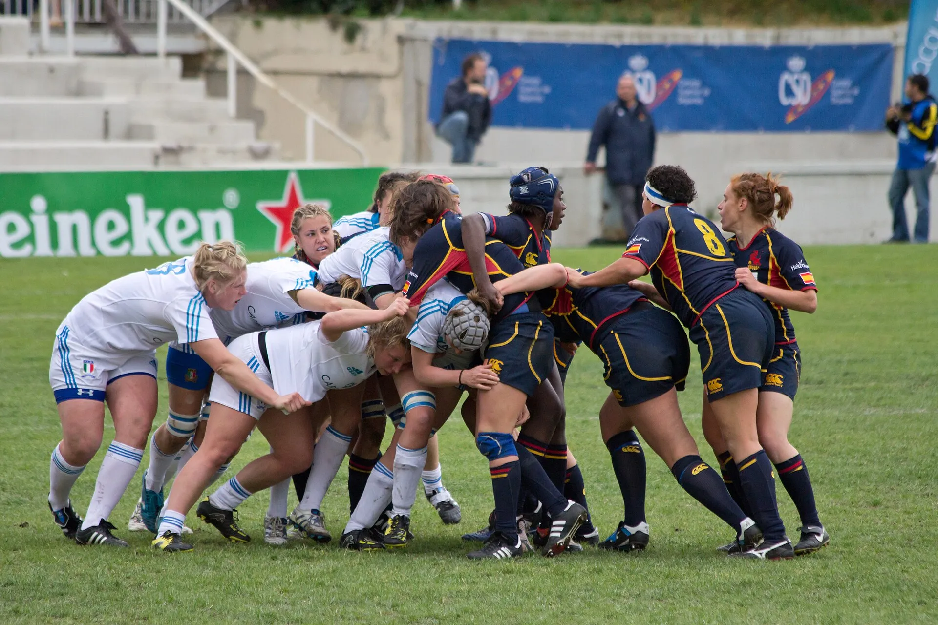 Players from two women's international teams drive into a tight maul