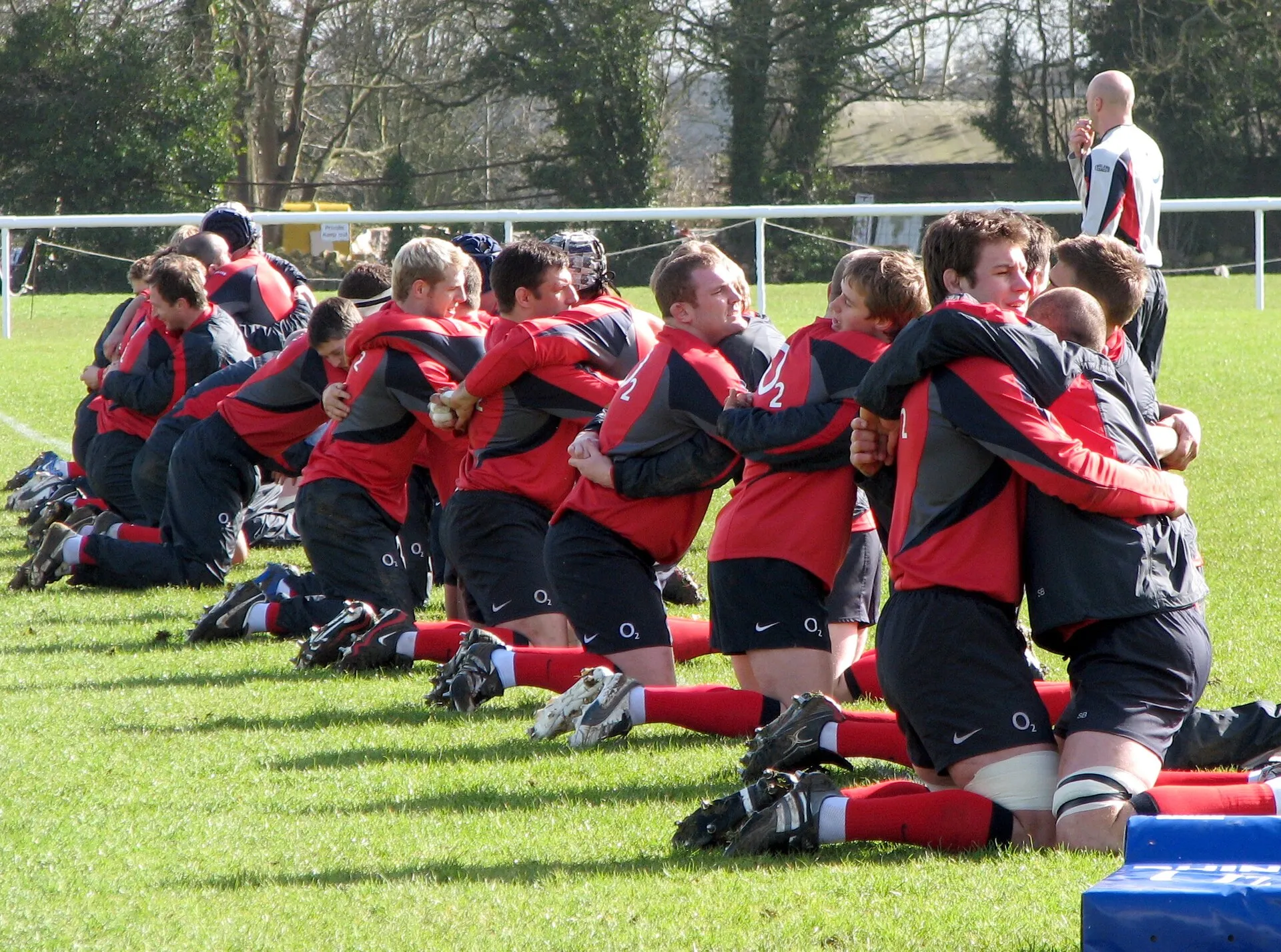 Rugby players working through a session on a training pitch