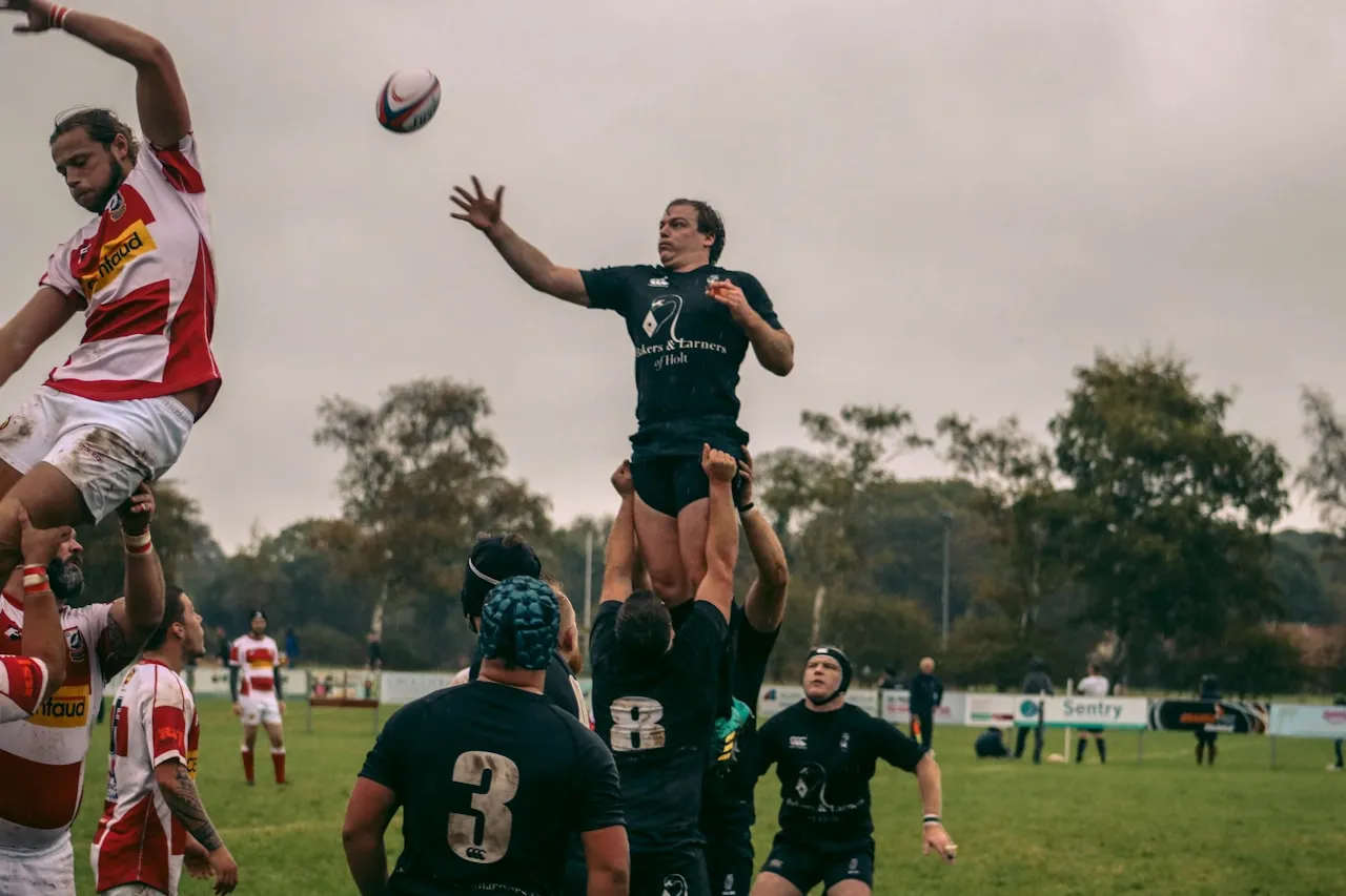 A lineout jumper lifted to take the ball at a grassroots match